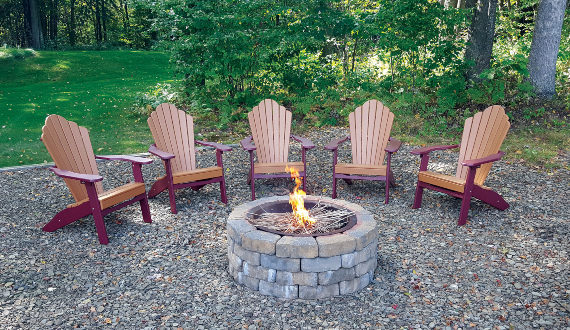 Adirondack chairs around a fire pit.
